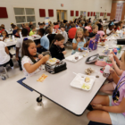students eating lunch in school cafeteria