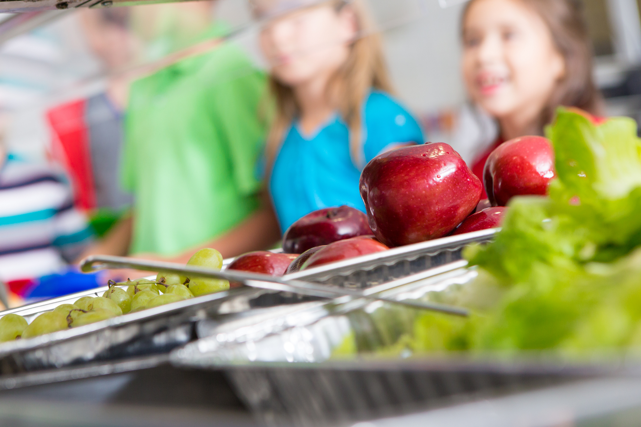 Closeup of healthy food in a school cafeteria lunch line.